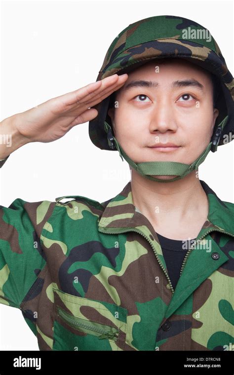 Man in military uniform saluting Stock Photo - Alamy