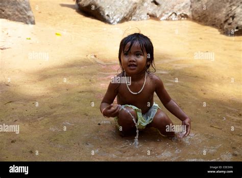 Little Girl Playing In River Siem Reap Angkor Cambodia Stock Photo Alamy