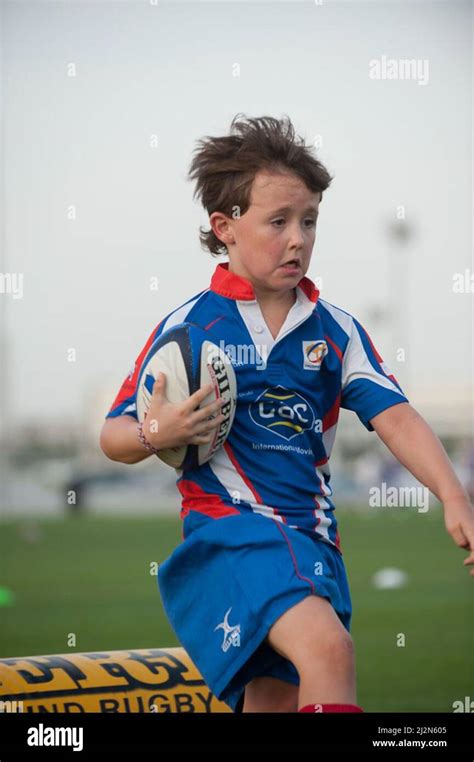 young kids playing rugby Stock Photo - Alamy