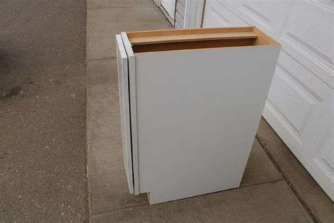 New 9" white kitchen base cabinet - Lee Real Estate & Auction Service