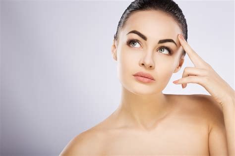 Premium Photo Attractive Girl With Black Hair Fixed Behind Big Eyes Thick Eyebrows And Naked