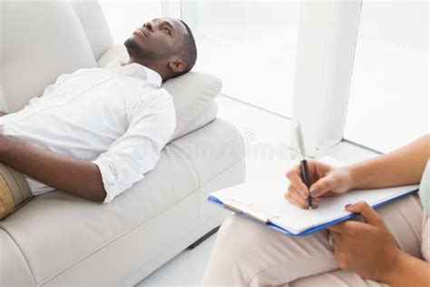 Man Lying On Sofa Talking To His Therapist Stock Photo Image 49308032