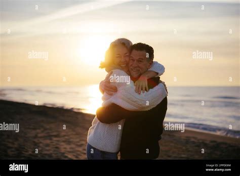 Smiling Mature Man And Woman Hugging Each Other Stock Photo Alamy