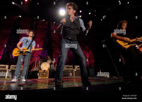 Musician John Mellencamp performs with his band, and his son Speck, far ...