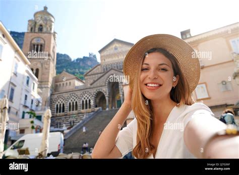 Happy Young Beautiful Tourist Girl Taking A Selfie Smiling At The