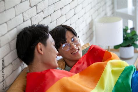 Happy Asian Gay Couple Talking Together And Relaxing At Home On Bed LGBTQ Concept Stock Photo