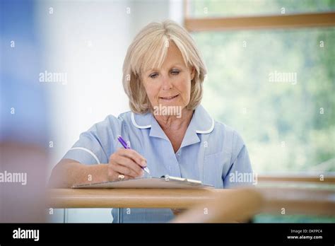 Mature Woman And Nurse Hi Res Stock Photography And Images Alamy
