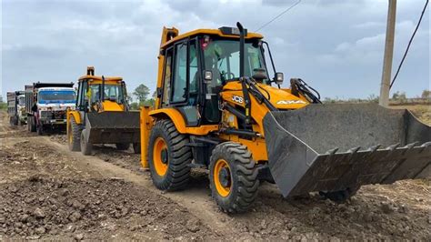 Jcb Dx Machines Loading Mud Together With Tata Dump Truck