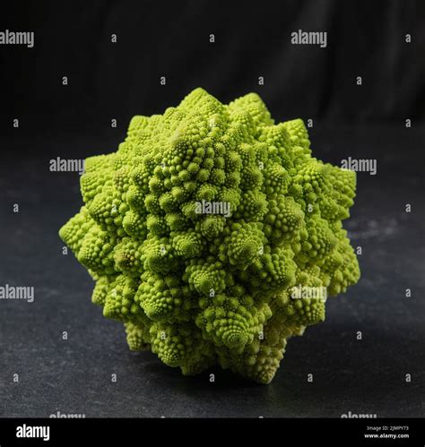 Romanesco Broccoli Head On A Dark Stone Surface Cabbage Close Up