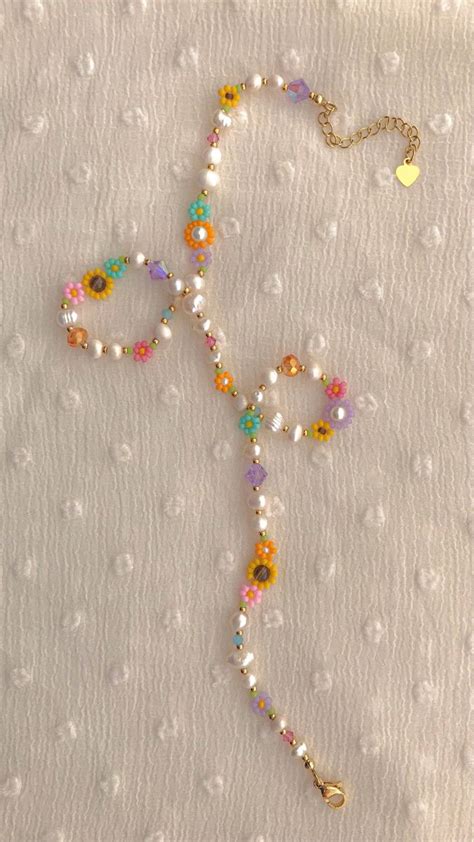 This Necklace Features An Assortment Of Bright Seed Bead Colors And K