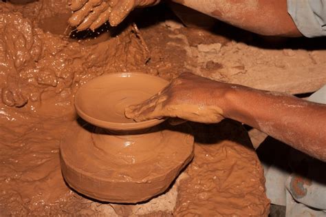 Premium Photo Potter Making Pots