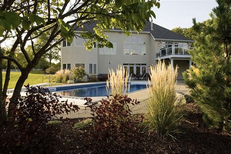 relaxing poolside magnolia landscape design
