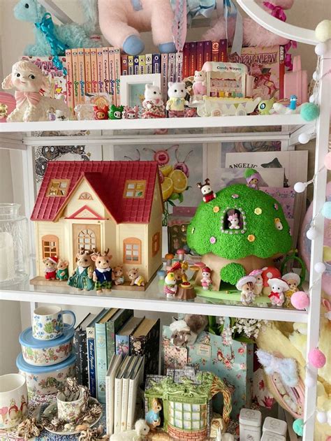 A Shelf Filled With Lots Of Different Types Of Toys And Books On Top Of It