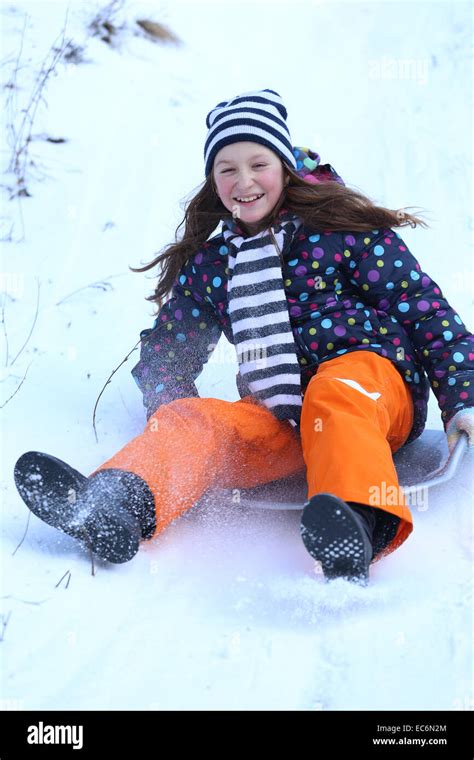 Winter Smiling Teen Girl Sledding Stock Photo Alamy