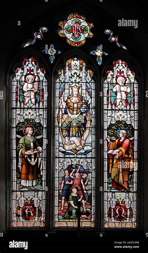 The East Stained Glass Window Depicting Christ In Majesty Saints John