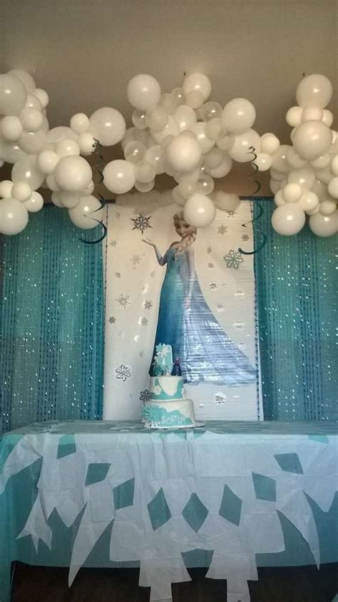 A Frozen Princess Themed Birthday Party With Balloons And Streamers