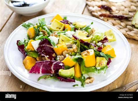 Avocado With Mango Rocket Walnut And Feta Salad By Balsamic Dressing