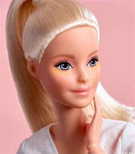 Barbie Doll With Blonde Hair And Blue Eyes