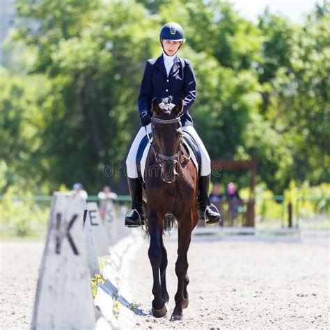 young equestrian girl performing  dressage test  equestrian