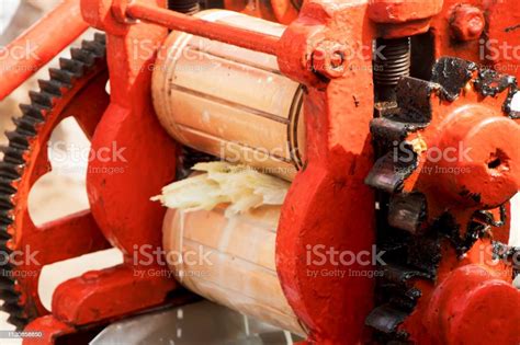 Sugar Cane Juice Machine Crusing Raw Sugarcane For Its Juice In A