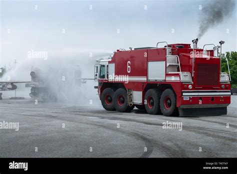 A P 23 Aircraft Rescue And Firefighting Crash Truck Sprays Water On A Training Aircraft During A