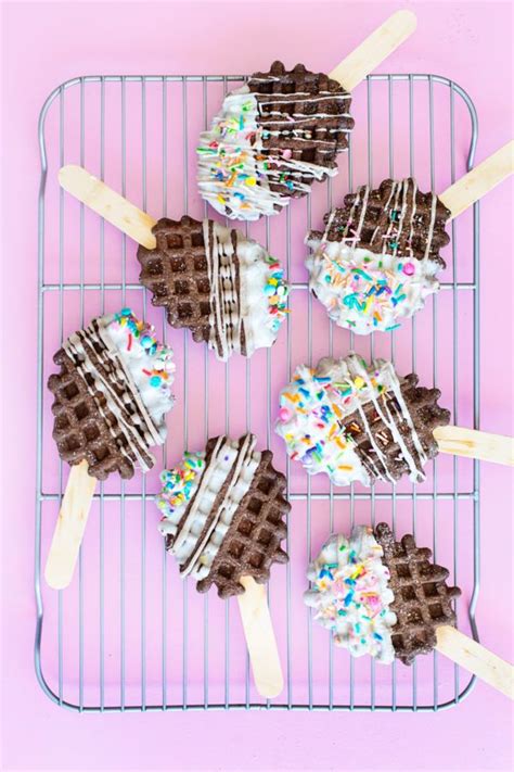 Chocolate Waffles With Sprinkles And Marshmallows On Them