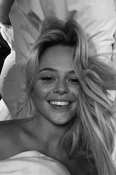 Emily Atack sets pulses racing as she poses in topless in bed after