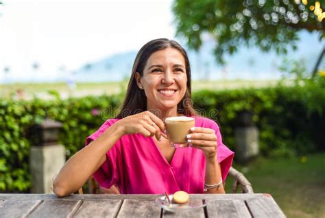 Portrait Of Smiling Russian Woman Drinking Hot Capuccino And Looking Left Stock Photo Image Of
