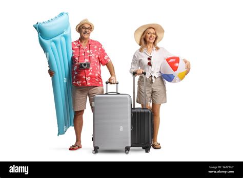 Happy Mature Couple With Suitcases Packed For A Summer Vacation Isolated On A White Background