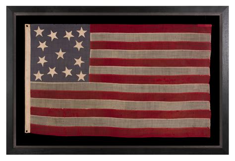 13 STAR ANTIQUE AMERICAN FLAG WITH A DUSTY BLUE CANTON MADE IN THE ERA