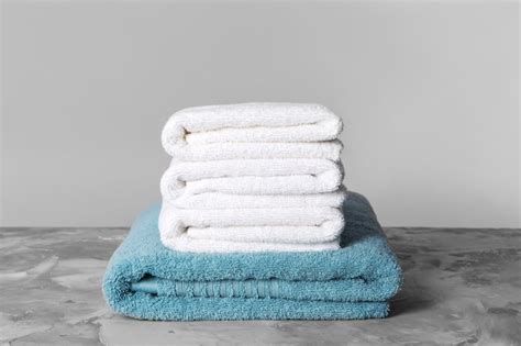 Premium Photo Stack Of Clean Towels On Table