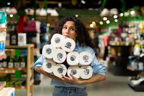 Portrait Of A Happy Woman Shopper In A Supermarket A Hispanic Woman