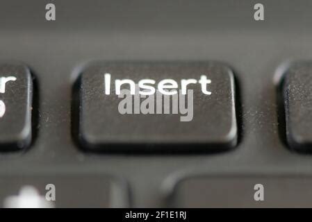 Insert key on a laptop keyboard Stock Photo - Alamy