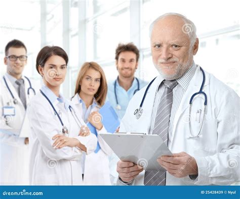 Portrait Of Aged Doctor With Medical Residents Royalty Free Stock Images Image 25428439