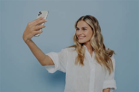 Blonde Teen Girl Snaps Selfie With Bright Smile Sharing Photos On