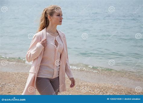 Blonde Girl In Autumn Walks On The Beach Ocean Stock Photo Image Of Caucasian Blue