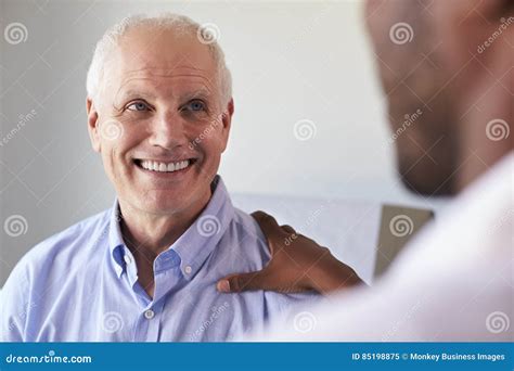 Doctor Meeting With Mature Male Patient In Exam Room Stock Image Image Of Fifties Black