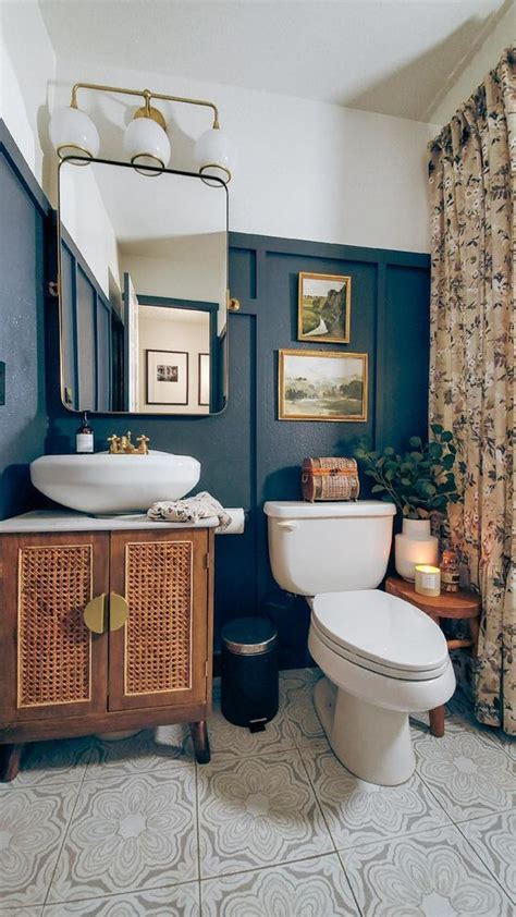 A Catchy Eclectic Bathroom With Black Paneling A Cane Vanity A Sink