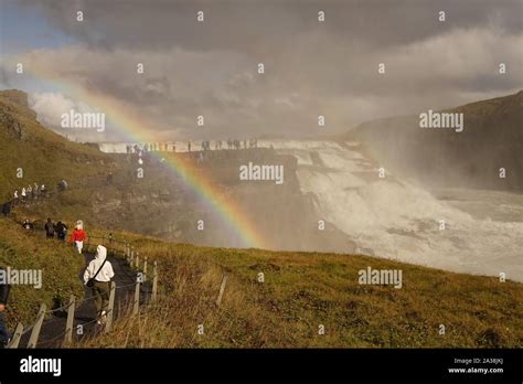 A rainbow across Gullfoss waterfall in Iceland Stock Photo - Alamy