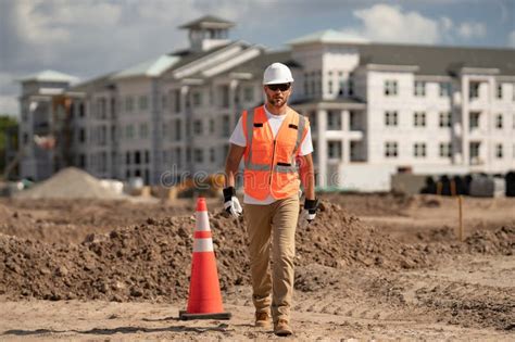 Construction Man with Helmet. Worker at Construction New Building ...