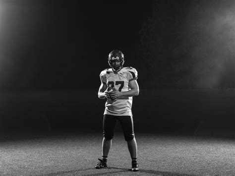 Premium Photo Portrait Of Confident American Football Player Holding