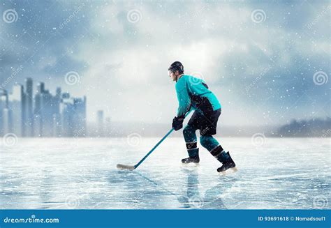 Ice Hockey Player In Action On Frozen Lake Stock Photo Image Of