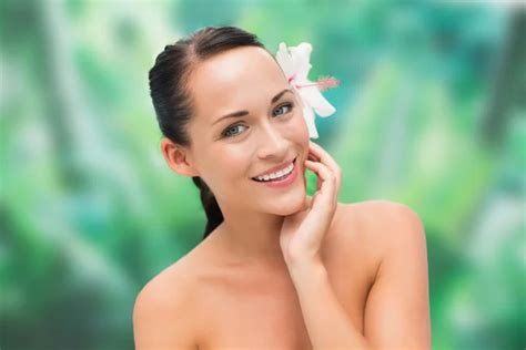 Beautiful Nude Brunette Posing With Green Leaves Stock Photo Wavebreakmedia 50044213