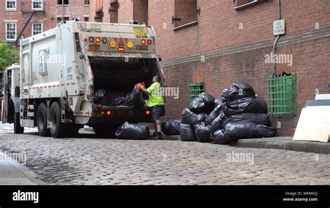 Brooklyn Ny June 7 2016 Dsny Workers Collect Trash On A City Street