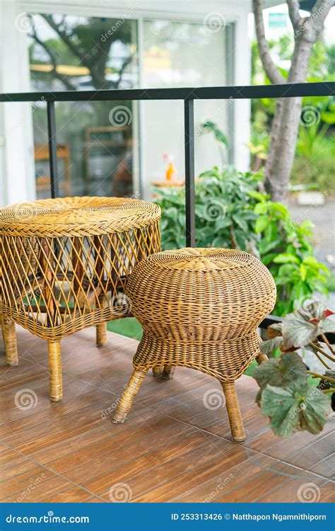 Wicker or rattan chair set stock photo. Image of pillow - 253313426