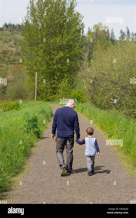 Father And Son Walking Away From Each Other