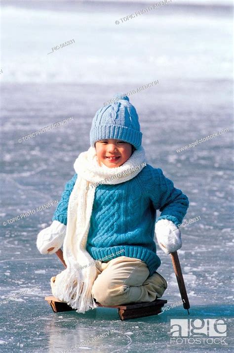 A Boy Sledding On Ice Korean Stock Photo Picture And Rights Managed