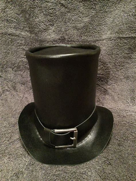 Abe Lincoln Top Hat. 8" high black leather with a removable black belt ...