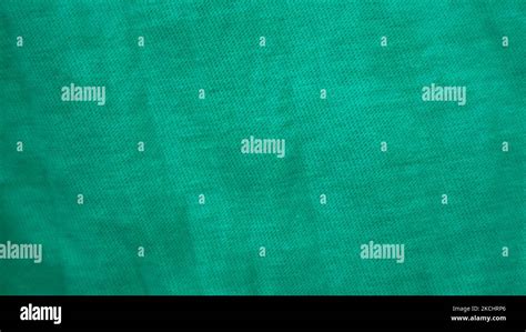 green fabric texture as background Stock Photo - Alamy