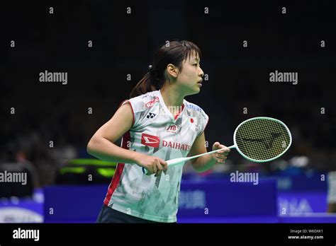 Nozomi Okuhara Of Japan Returns A Shot To Gao Fangjie Of China In Their